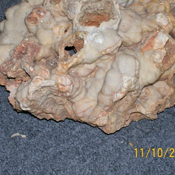 Unknown Old Rock with white glitter type growth on it ?
