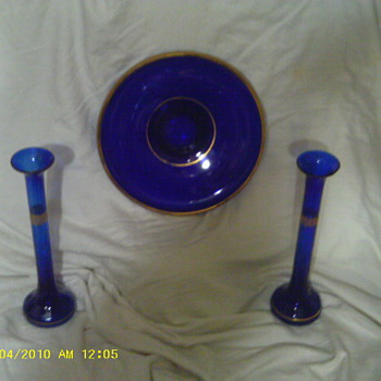 all i know its blue glass cant find any info at all on these items i beleive they r a set - Glassware