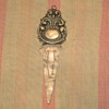 old silver book marker 
