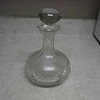 SEVERAL GLASS DECANTERS