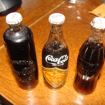 3 in filled glass coke bottles with metal caps - Coca-Cola