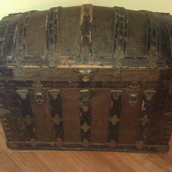 Antique trunk with name. Also name of lock company.