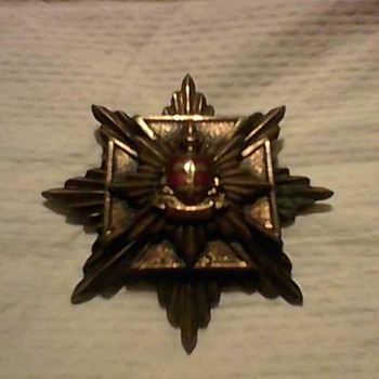 A BRITISH STARBURST MEDAL - Medals Pins and Badges
