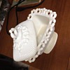 milk glass covered dish lacey edge , powder or candy?