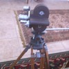 wooden movie tripod and camera
