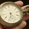 silver (?) heavy men's antique pocket watch with train engraving