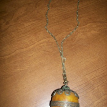 silver chain and amber,,, beeswax?