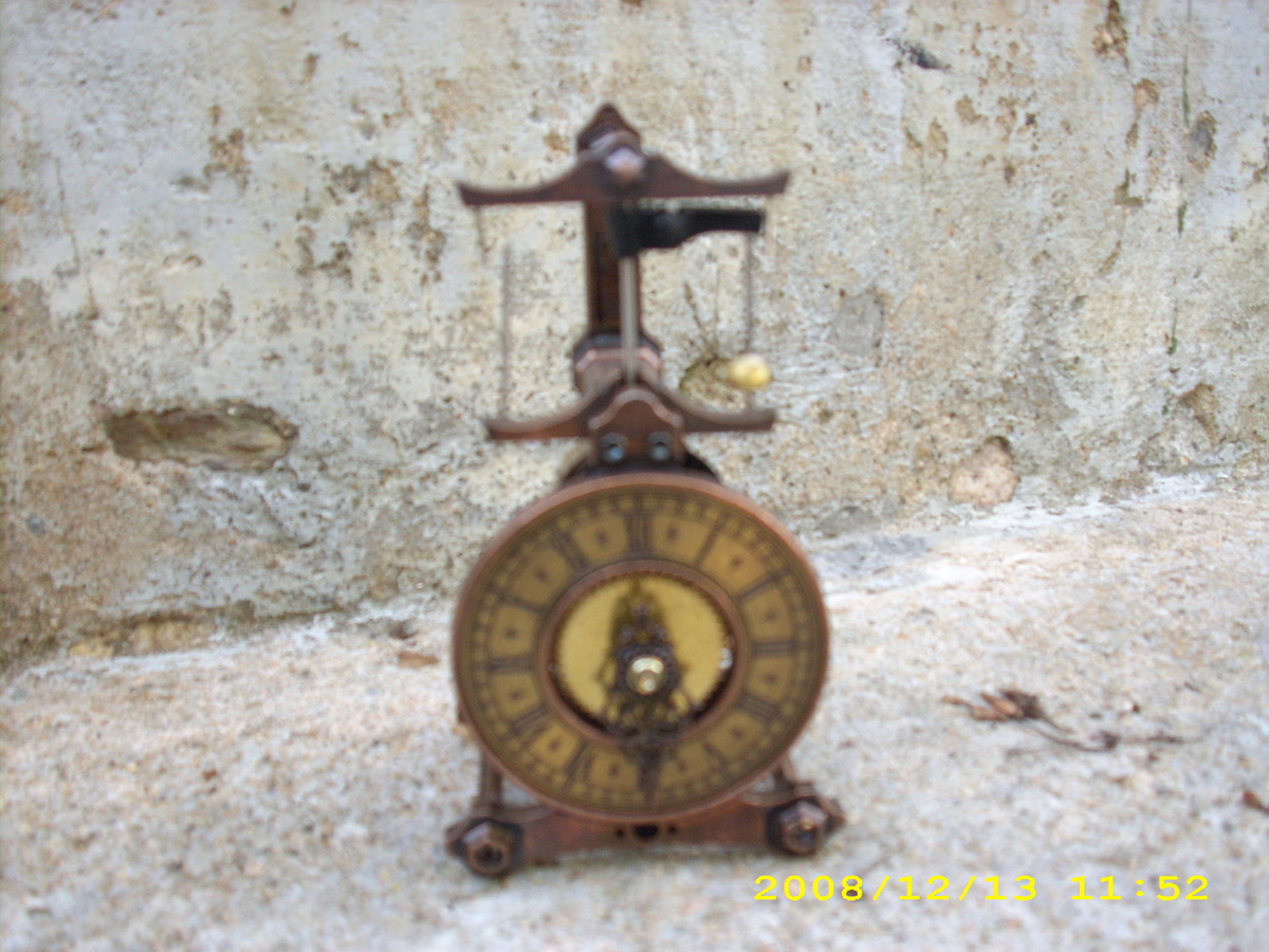 Guild clock with flying pendulum Collectors Weekly