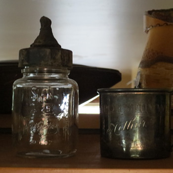 An old baby bottle and silver childs mug - Bottles