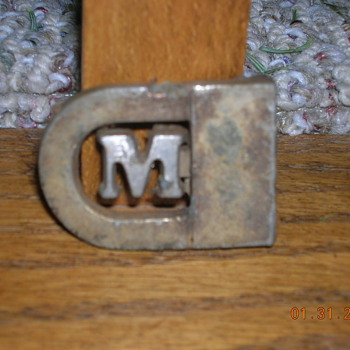 Maybe a belt buckle? - Accessories