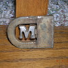 Maybe a belt buckle?