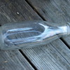 Six 1QT Early Glass Dairy Milk Bottles in Primitive Wire Scroll Carrier