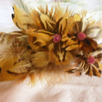 Vintage corsages, One feather the other a patriotic made with postage stamps.