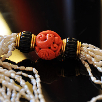 Exceptional Early Cartier Carved Coral Bead, onyx and pearls necklace, with 18k solid gold mount