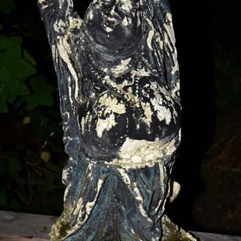 Weather worn and moss-covered Buddha - still happy!