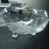  GLASS BOWL WITH ECTHEDING ON IT.