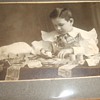 Antique photograph of a boy banker with King of Bills