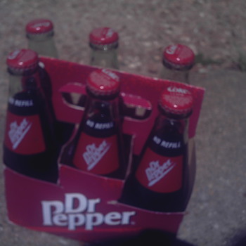 Dr Pepper bottles....but with Coke Classic caps!
