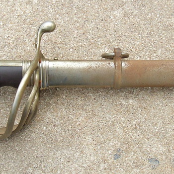 Here is an interesting dress sword that I would like to share.