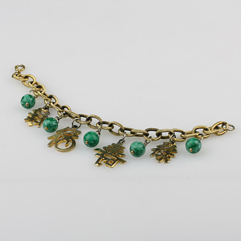 Gold tone charm bracelet and necklace with chinese theme