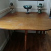 Antique table with droppable sides