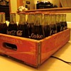 Unopened Coke bottles & crate