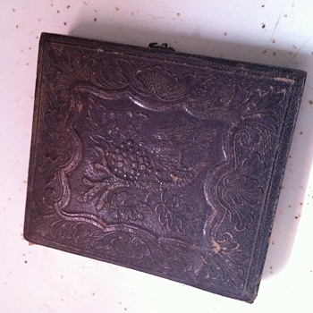 leather case/mirror with image in it