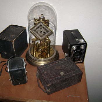 Small camera collection and grandmas clock. - Cameras