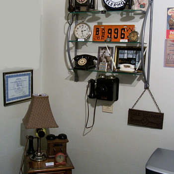 Some old toy phones on shelf... - Telephones