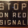 Cat Eye Railroad Stop on Red Signal Sign