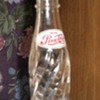 very small Pepsi Cola bottle