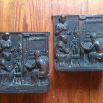 Is anyone familiar with the relief designs on these antique brass bookends?