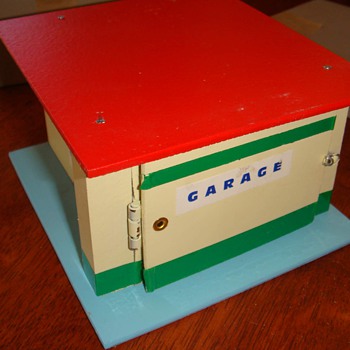 garage with a small doll prank joke from the 50's