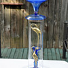re cycled glassware into garden art