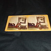 Handtinted stereoview of girl with toys and bird