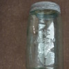 THE QUEEN Green glass jar-history? is it worth anything?