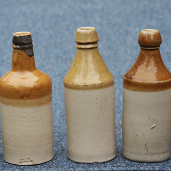 ---Tan and White beer bottles---