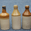 ---Tan and White beer bottles---