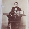 Salesman or Inventor with an early sewing machine