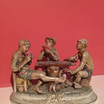 Three kids playing poker (cheating) 