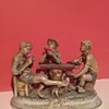 Three kids playing poker (cheating) 