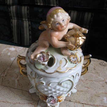 This was my grandmothers.my mother thinks it is a hat pin holder.I don't know.