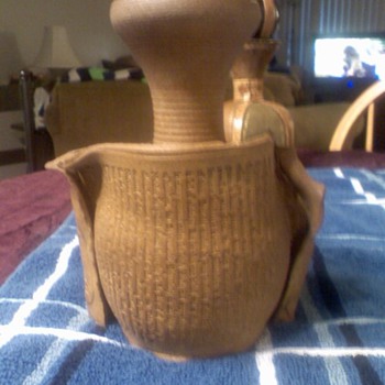 pottery, the poem deserida completely scrolled upon it 