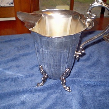 Mysterious pitcher with a crown (and nothing else) on the bottom