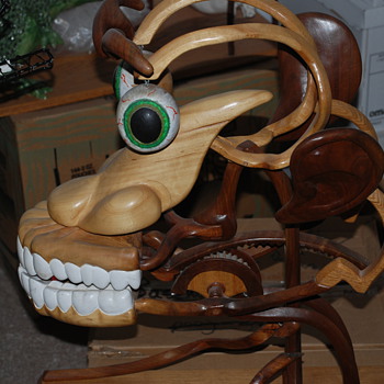 wierd wood face sculpture
