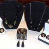 COLLECTION OF VINTAGE BLACK HAND PAINTED CELLUOID GEMS