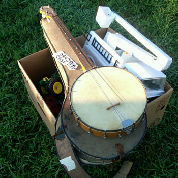 Can any one tell me anything about thisopen back 4 string banjo?