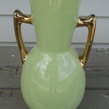 small green vase with gold trim