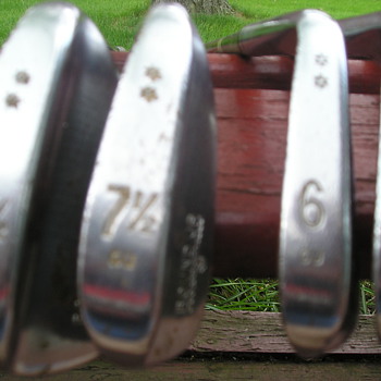 Mysterious set of Wilson RoundUp Golf clubs . with 7 1/2 and 81/2 irons.