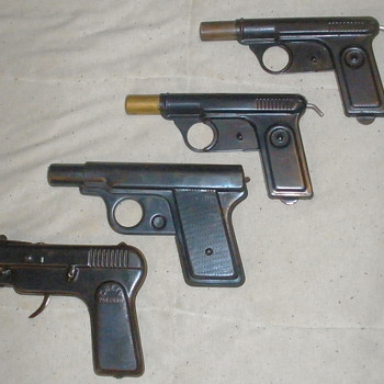 Pressed steel guns, Daisy water pistols and Chein sparking gun.  - Military and Wartime